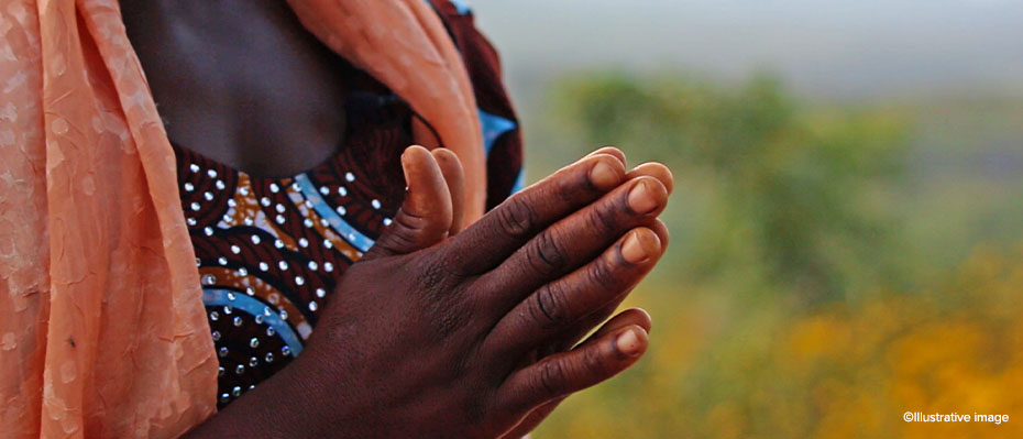 Praying Nigerian woman
